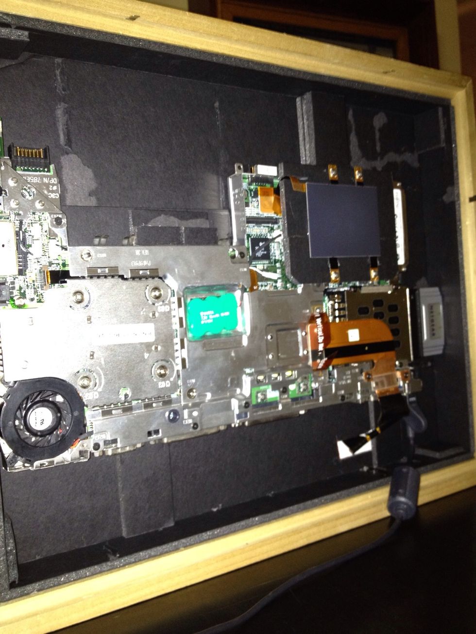 After placing strips and securing system board with locking strips. Place power cord in place to test fit.