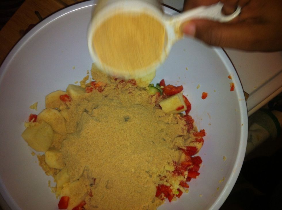 After placing the garlic in the bowl add the bread crumb into the bowl