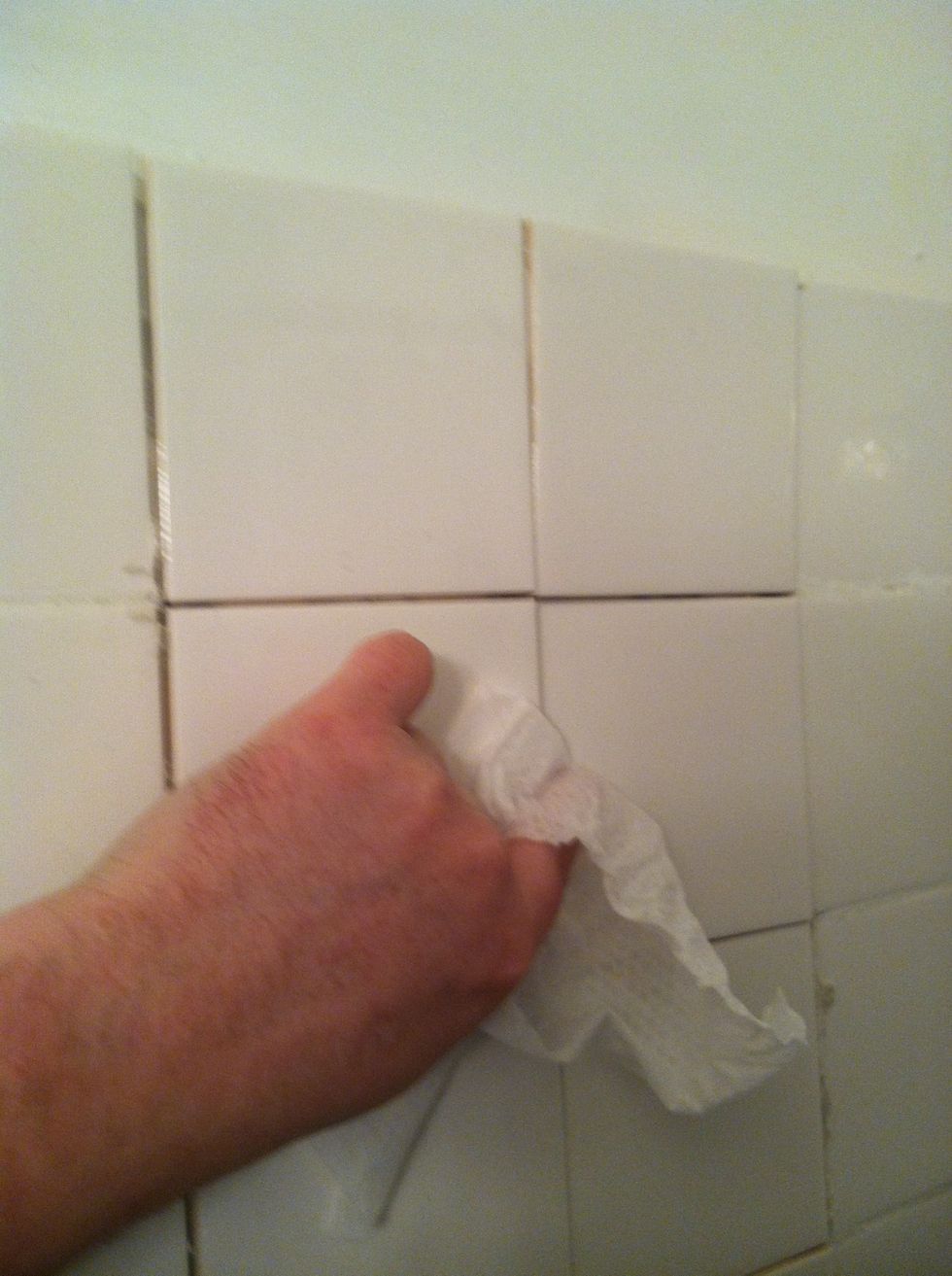 After placing tiles (I did not have room for tile spacers as this is fixing someone else's mess) clean off any extra thinset - once it sets you will have a lot of trouble getting it off