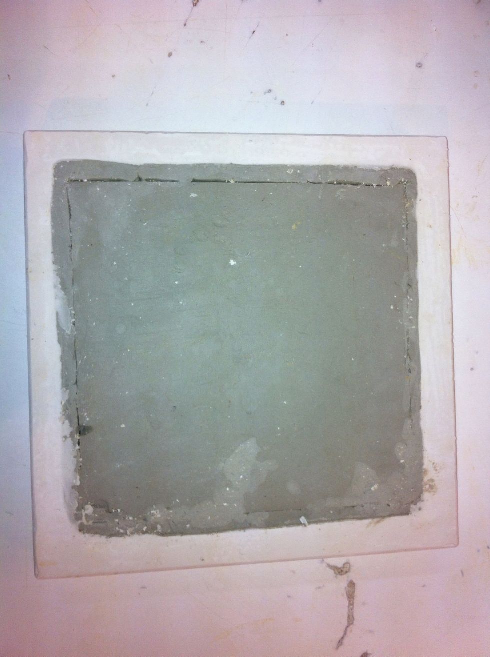 After plaster loses its sheen and has hardened some, invert and trim off any extra globs