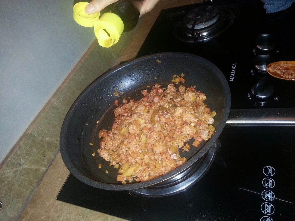 After, pour the sesame oil around the food.