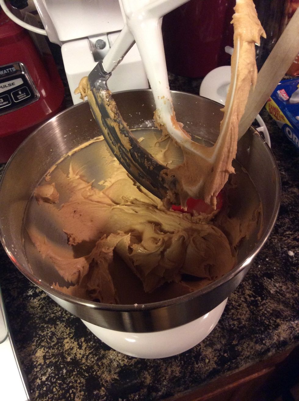 After powdered sugar, peanut butter, and butter being mixed together.