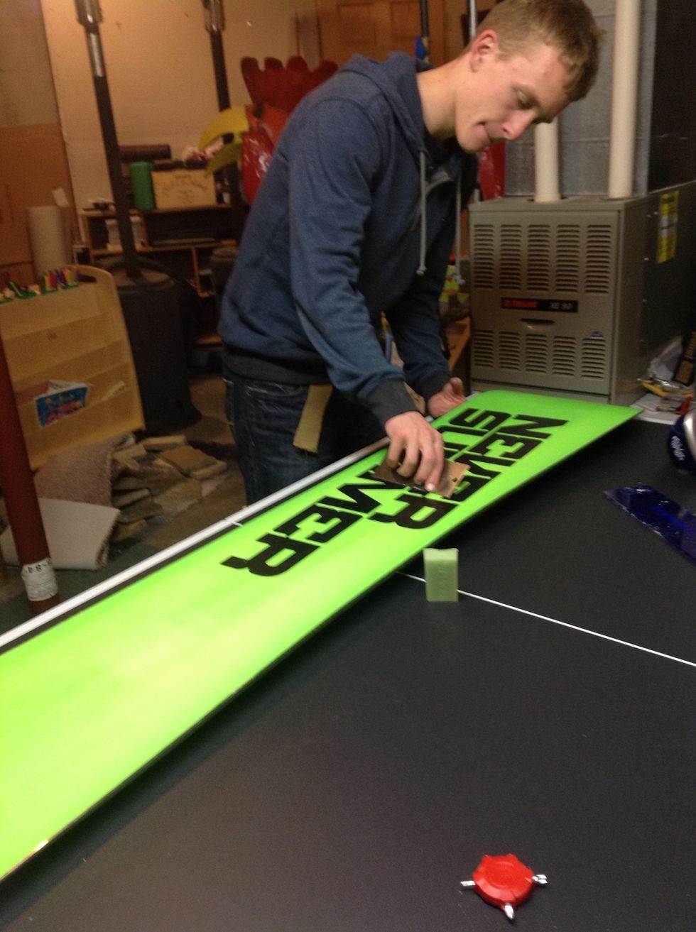 After putting the new wax on scrape off extra wax until smooth.