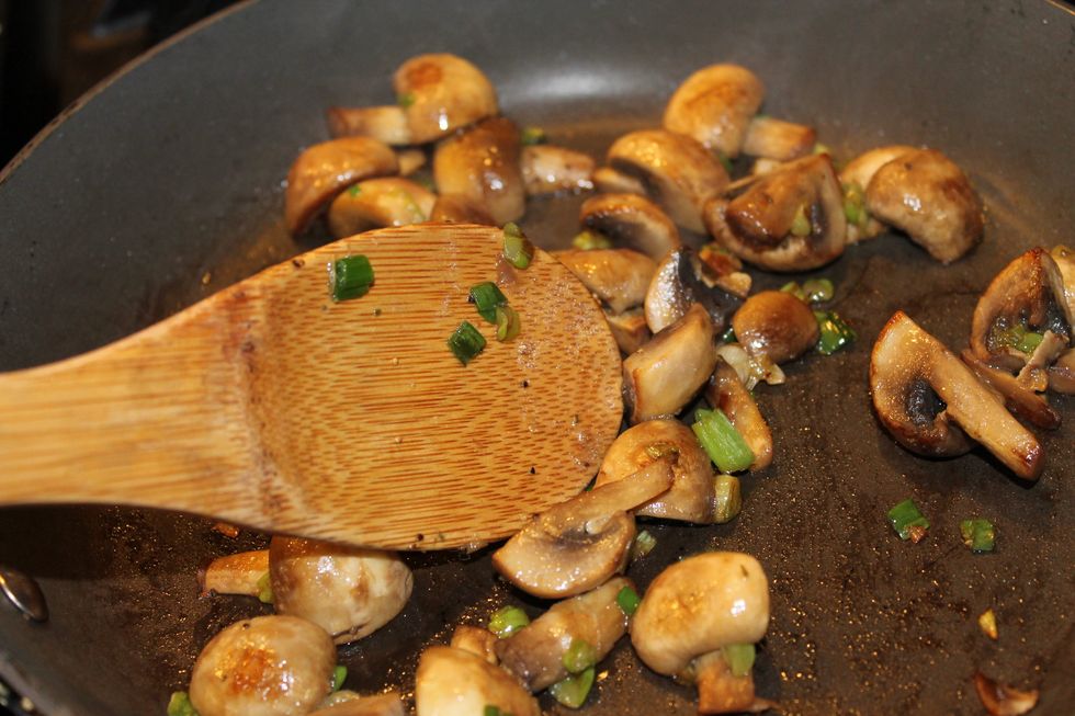 After quartering your mushrooms and dicing your green onion, add them to a heated pan with your olive oil. Saut\u00e9 until tender, about 5-6 minutes stirring occasionally. Season with seasoned salt.