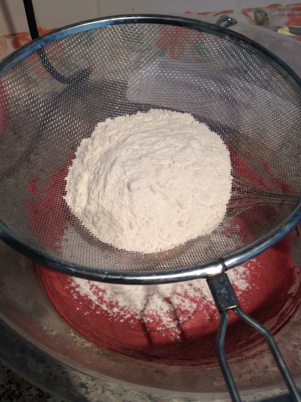 After reaching that consistency, sieve the flour into mix and the salt. If you have an electric mixer, sieve the flour whole, otherwise if mixing by hand do it bit by bit