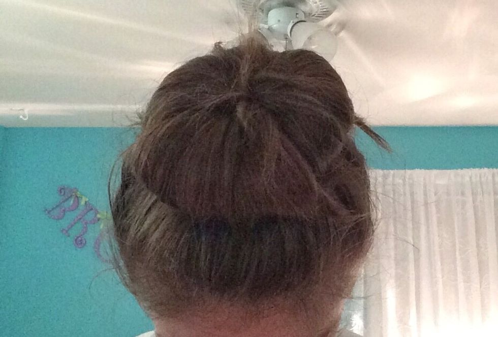 After repeating the steps, spread your hair around the bun maker.