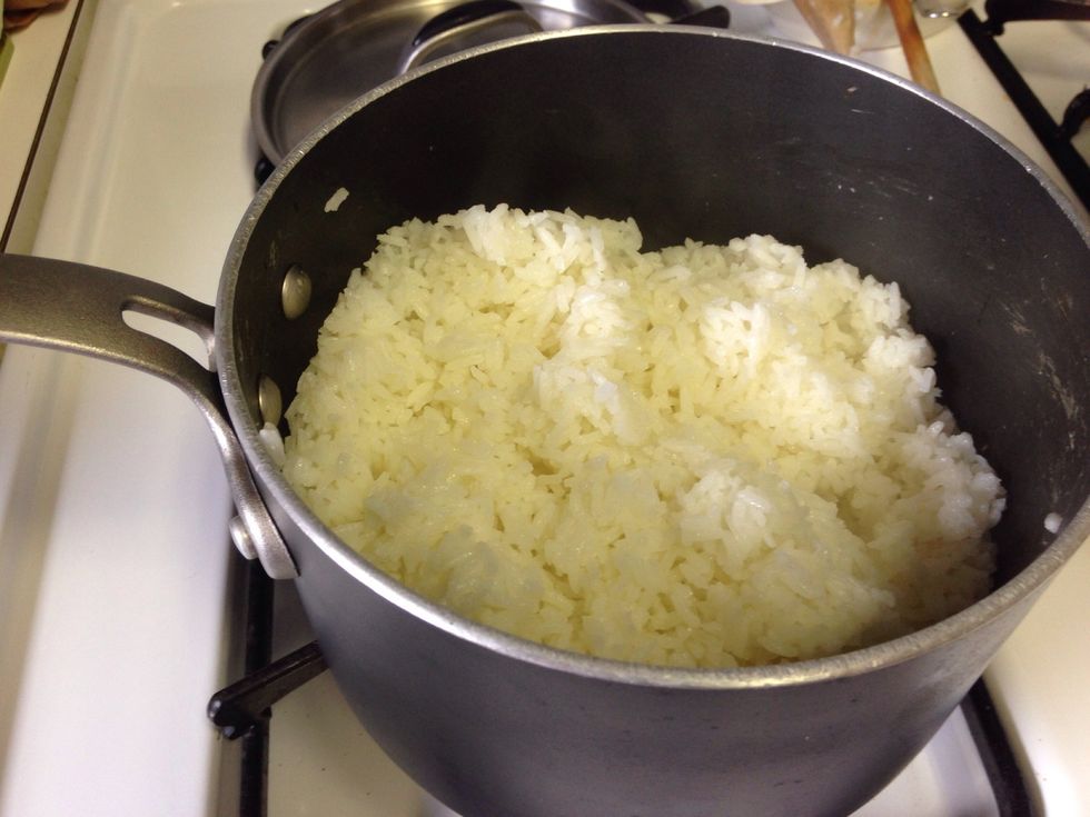 After rice cooks fluff (softly stir up) with a wooden spoon. Cover and set aside