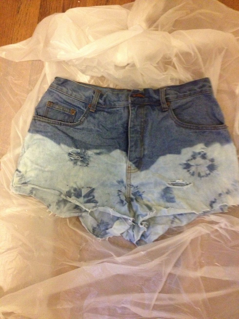 After rinsing them for around 2-3 minutes, put them in the washing machine and let them go through a cycle in warm water. Then, put them in the dryer or let them air dry.