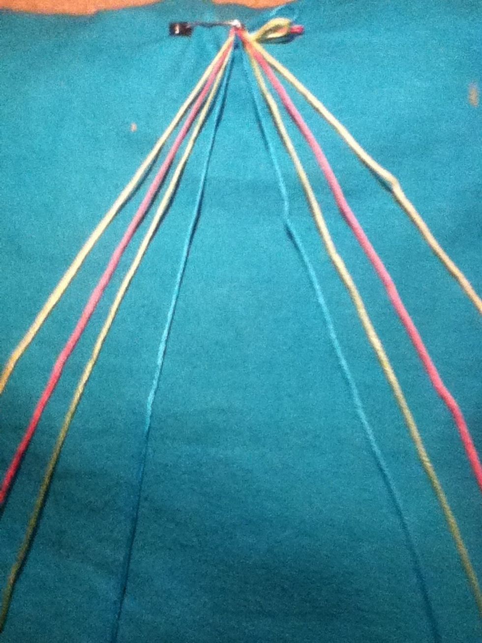 After safety pining it to something Separate the colors one of each color on one side and make them the same color order on both sides