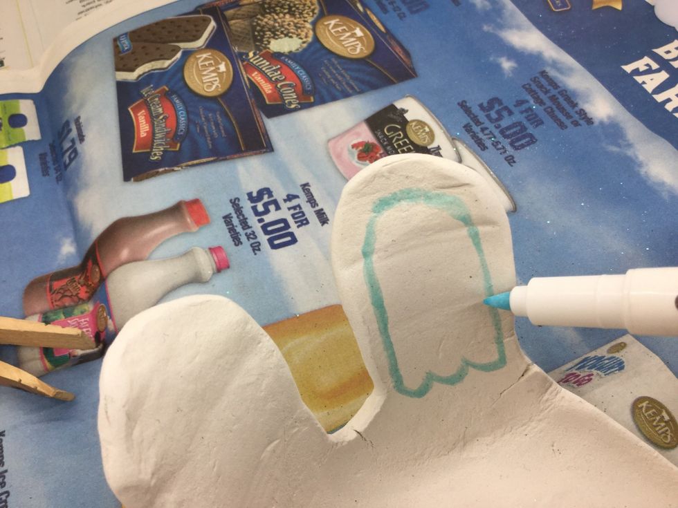 After sanding the edges, draw ears & face with the Emboss It Pen. TIP: Only draw 1 item at a time, sprinkle on embossing powder, remove excess, then repeat this process for the remaining features.