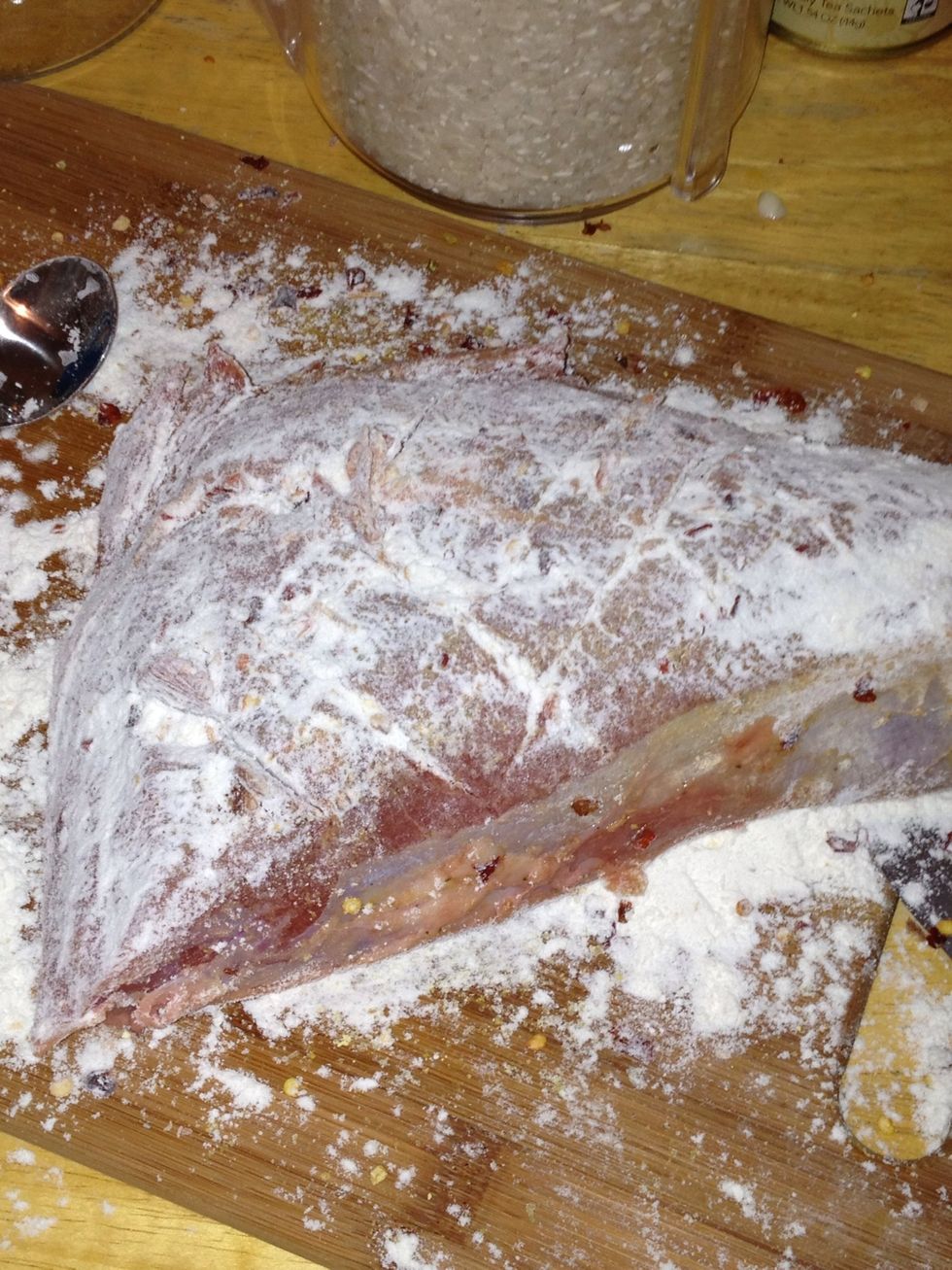 After seasons put flour on both sides so the meat will brown and begin a rue for sauce as well