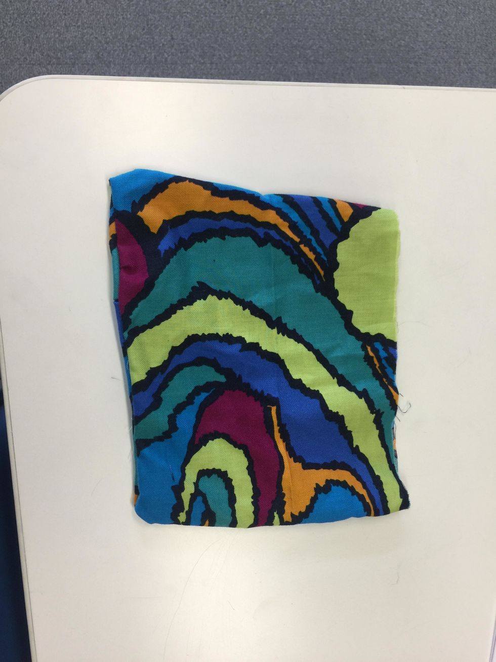 After sewing the fabric together leave the top of the fabric unstitch to add the zipper