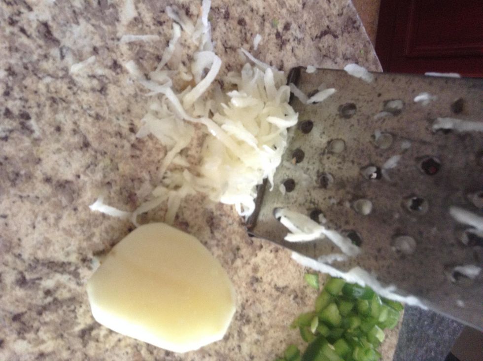 After shredding the potatoes, put the pieces aside.