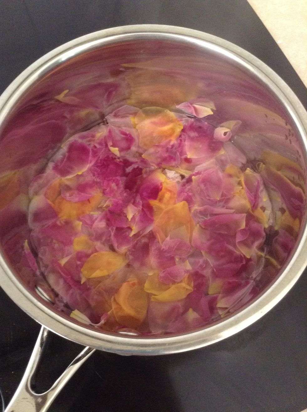 After simmering the color of the petals should have drained. Let cool.