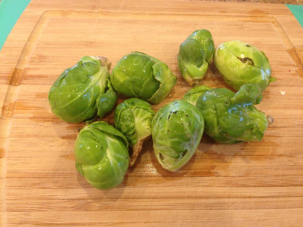 After soaking, grab a few out of the bowl and peel away any leaves that are hanging off or not tight against the sprout. They should just pull or peel right off.