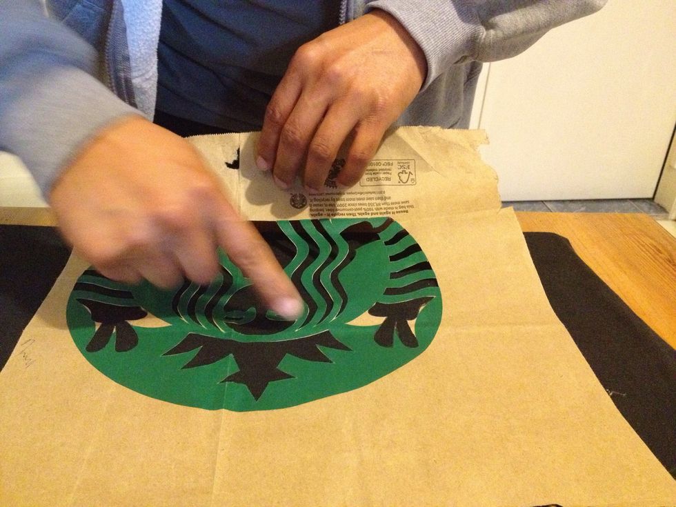 After spraying place stencil on T.