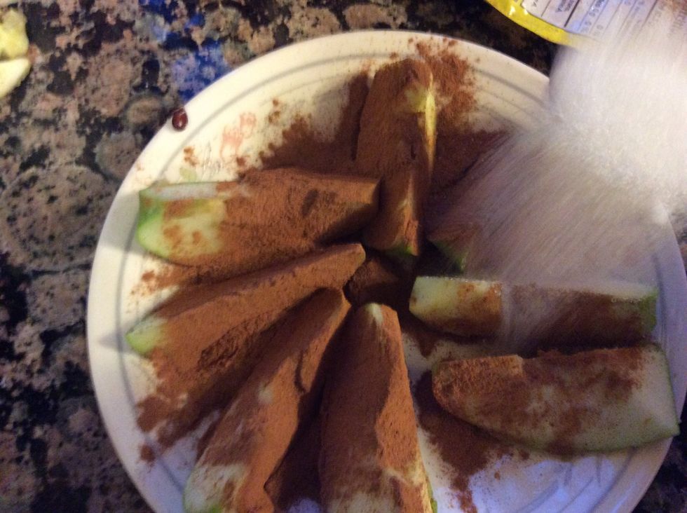 After sprinkle the sugar equally on each apple slice overtop the cinnamon