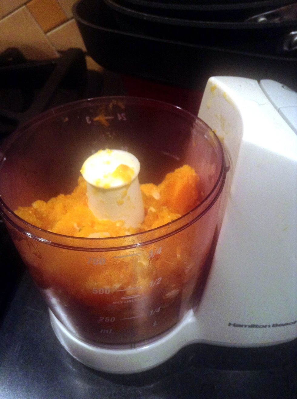 After squash is fork-tender, remove from heat and discard thyme.  Transfer mixture to a food processor or blender pulse until smooth.  Set aside.