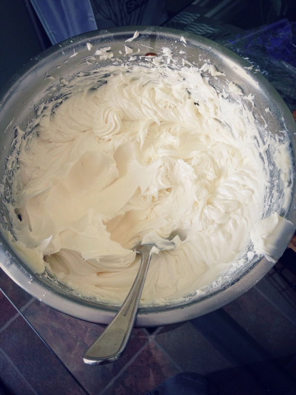 After stacking each layer from darkest to lightest, prepare buttercream from a recipe of your choice to frost the cake. I would double the recipe as you'll need tons of it!