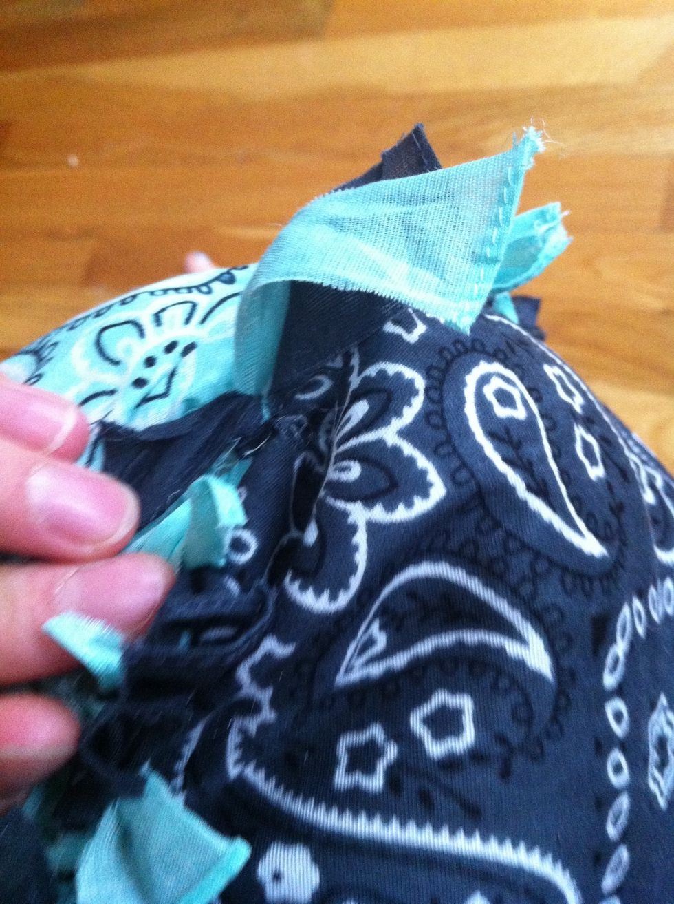 After stuffing it, tie all of the strips that have not been tied