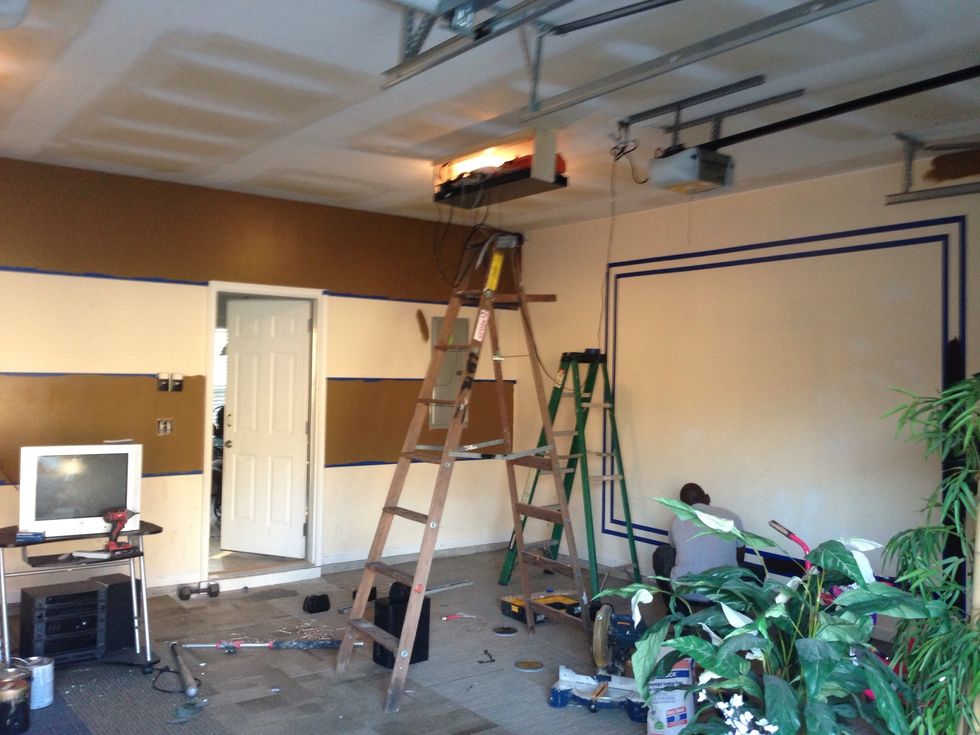 After taping the walls, we put on our 1st color and paint The designated areas