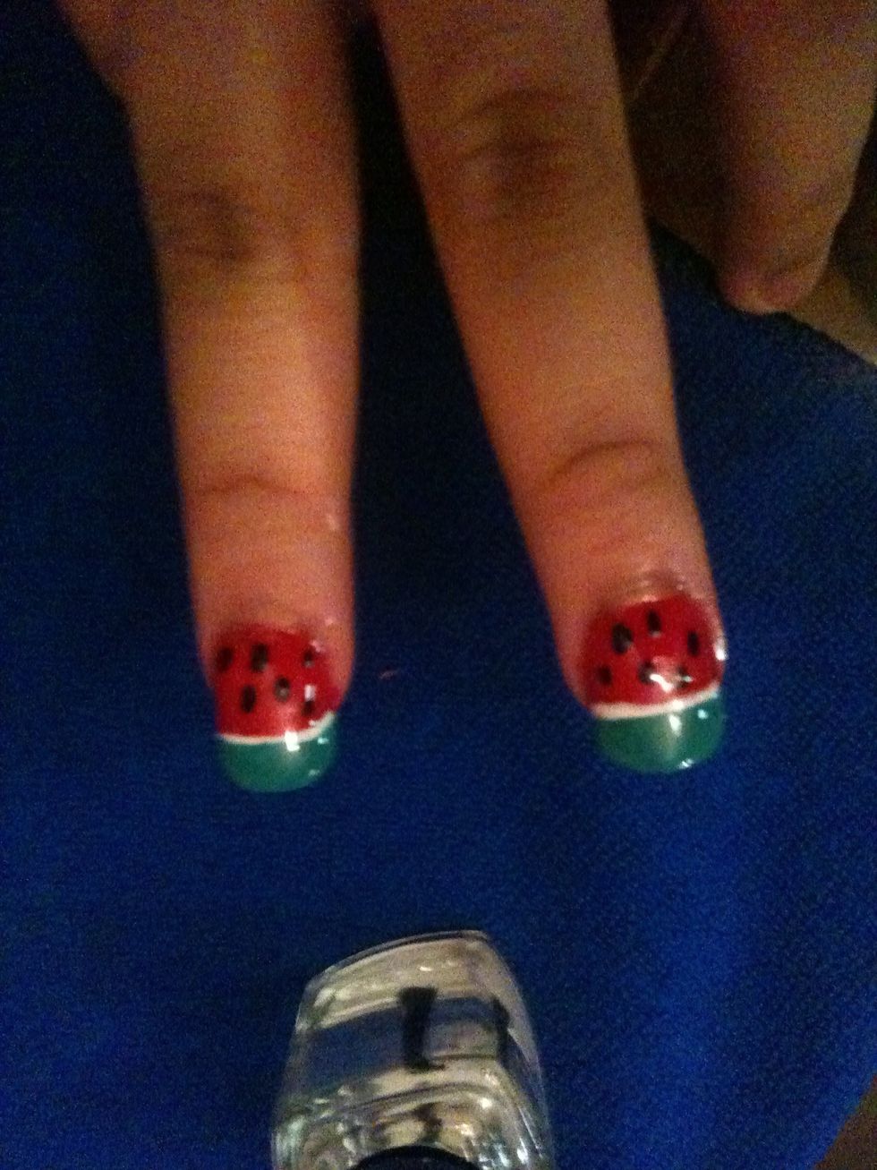 After that add black dots for seeds and a top coat.