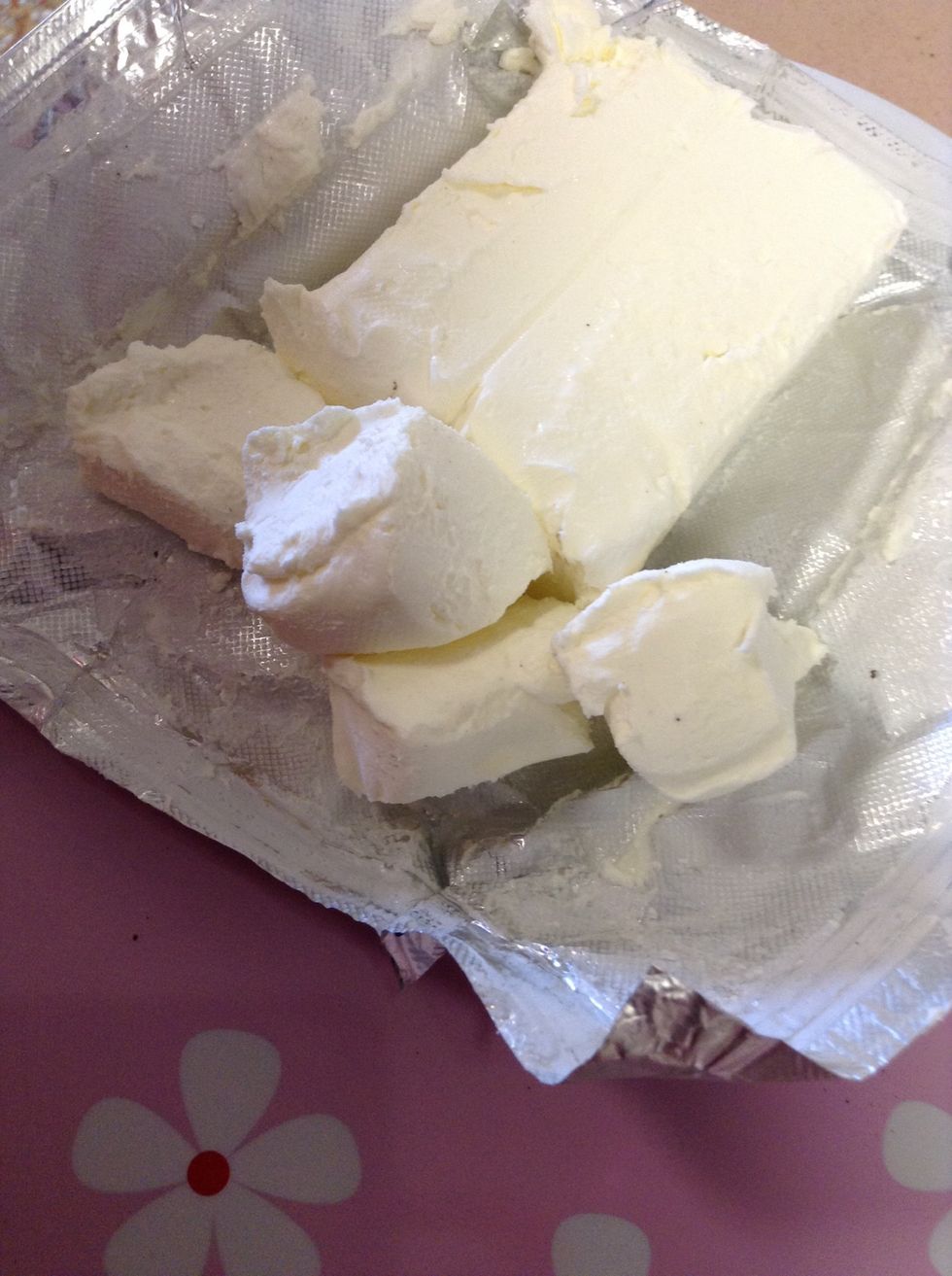 After that, Add cream cheese cut a chunk and then cut that into fourths.