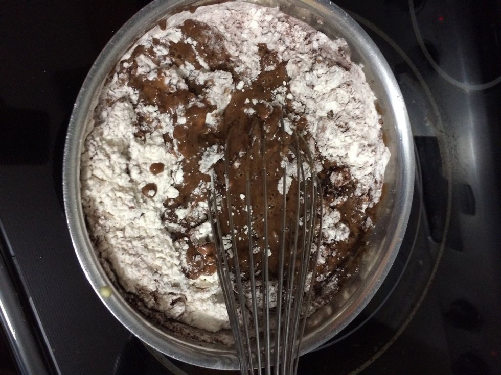 After that add in the eggs, flour, cocoa powder and baking soda in as well