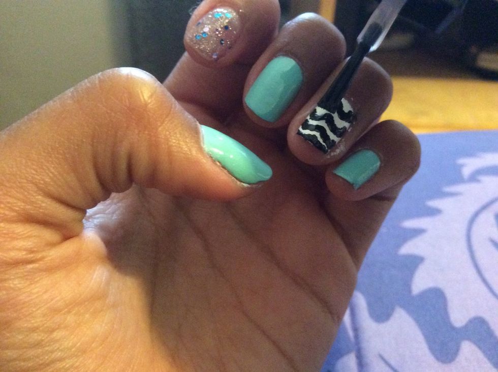 After that add Mattel top coat it's ok if the polish spreads that's what we want