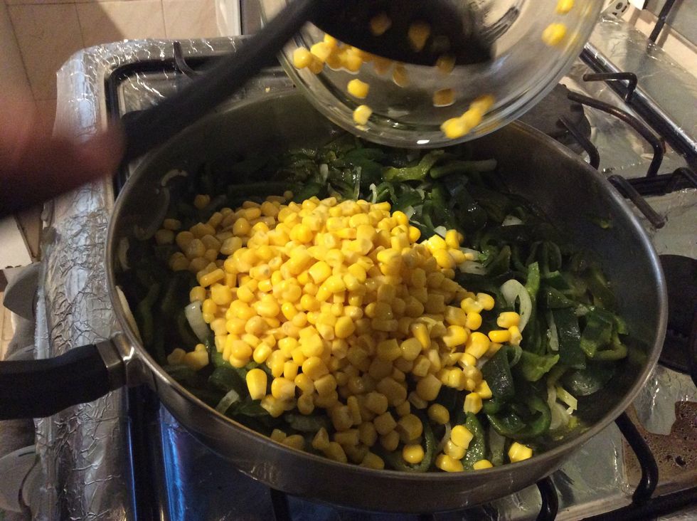 After that add the grains of corn