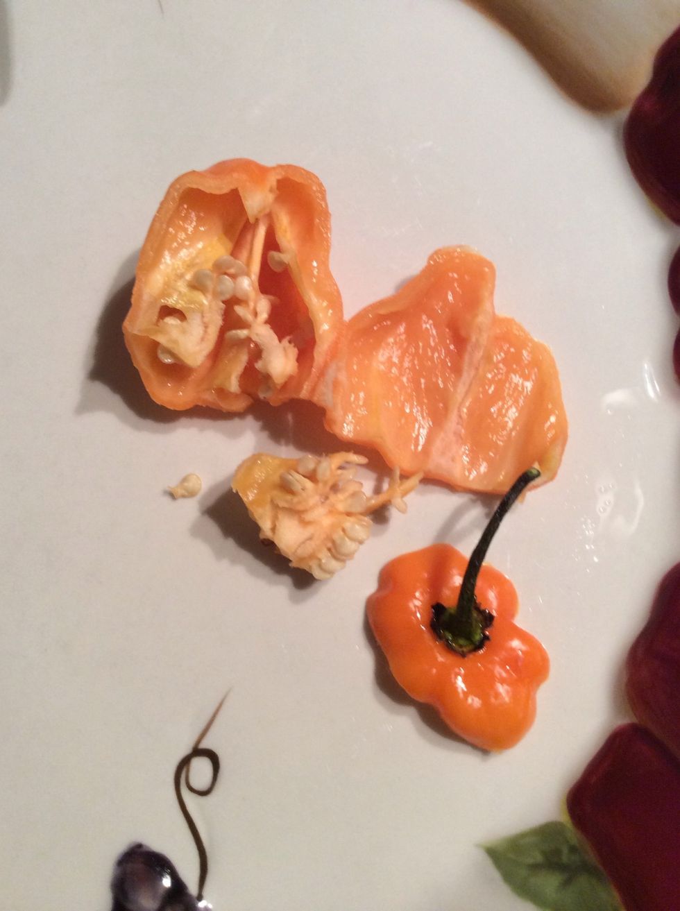 After that, cut off the top and the inside seeds. Use as much as you would like with this pepper because some people like more spicy and some people don't like as much. Add what you think is best.