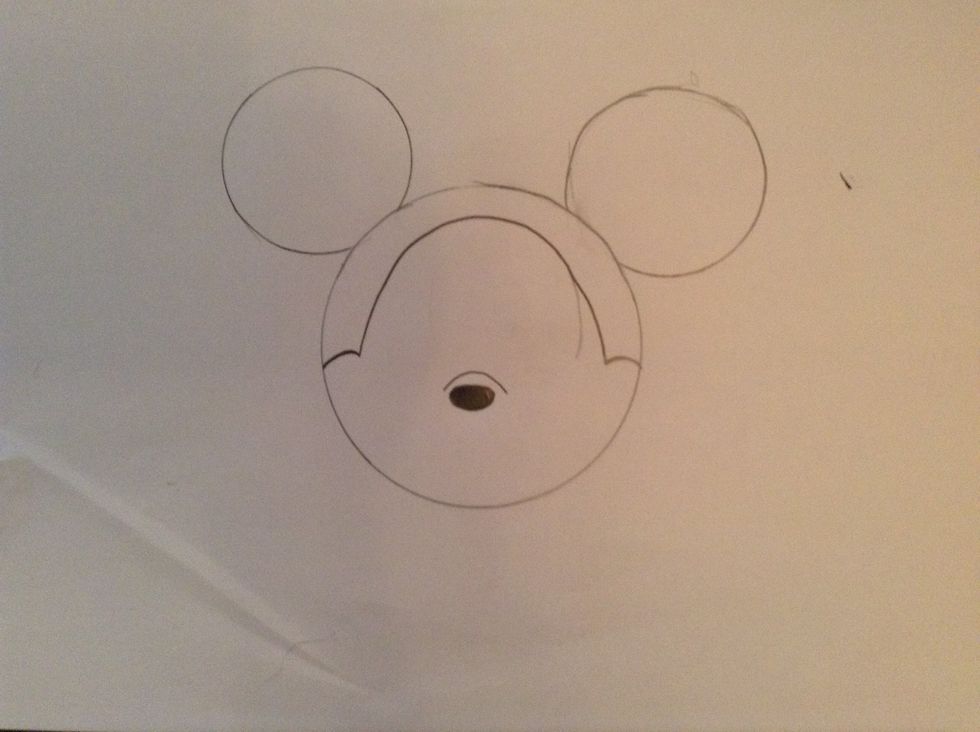 After that,draw a nose under the curve and color it in\ud83d\udc43