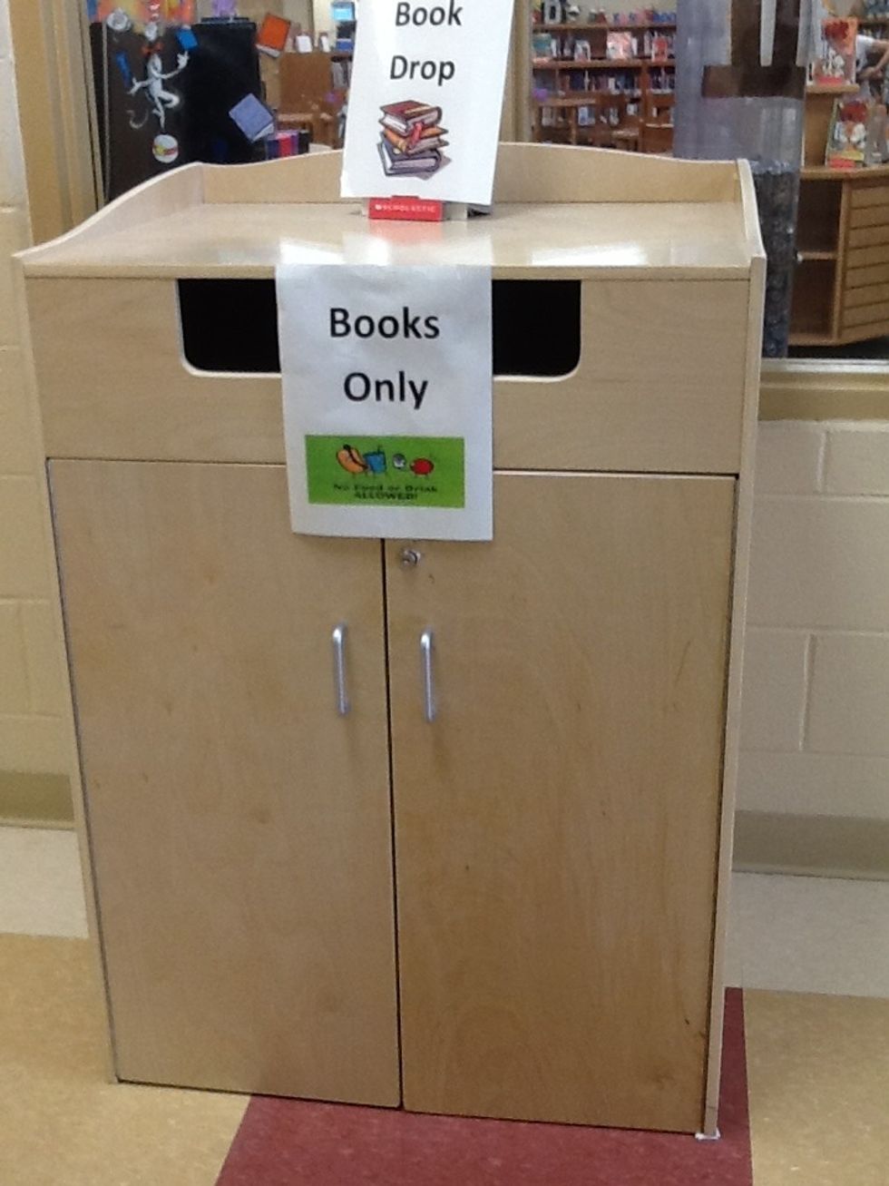 After that, find the book drop that is next to the door. It has two signs on it that says Book Drop and Books Only.