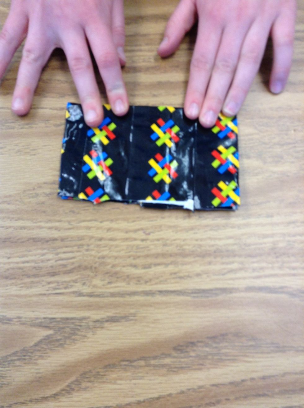 After that, fold the long sides in, crease it.