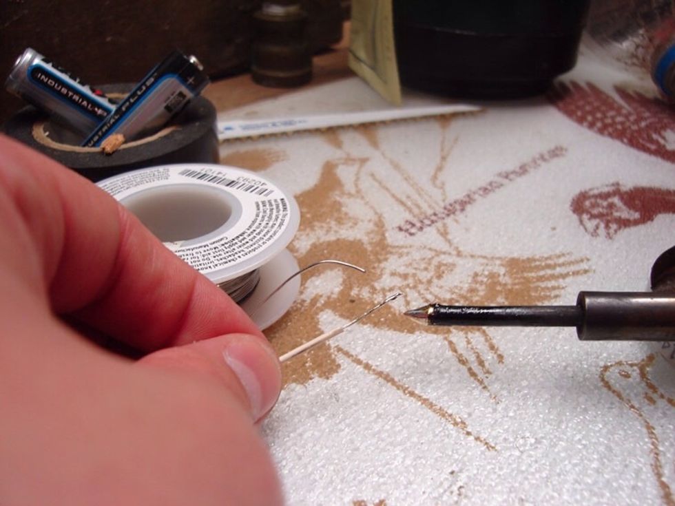 After that i suggest you tin the wires. Dip your iron in a little flux to clean it off, then get a tiny drop of solder on the ends of each wire. This will make attaching them a lot easier.