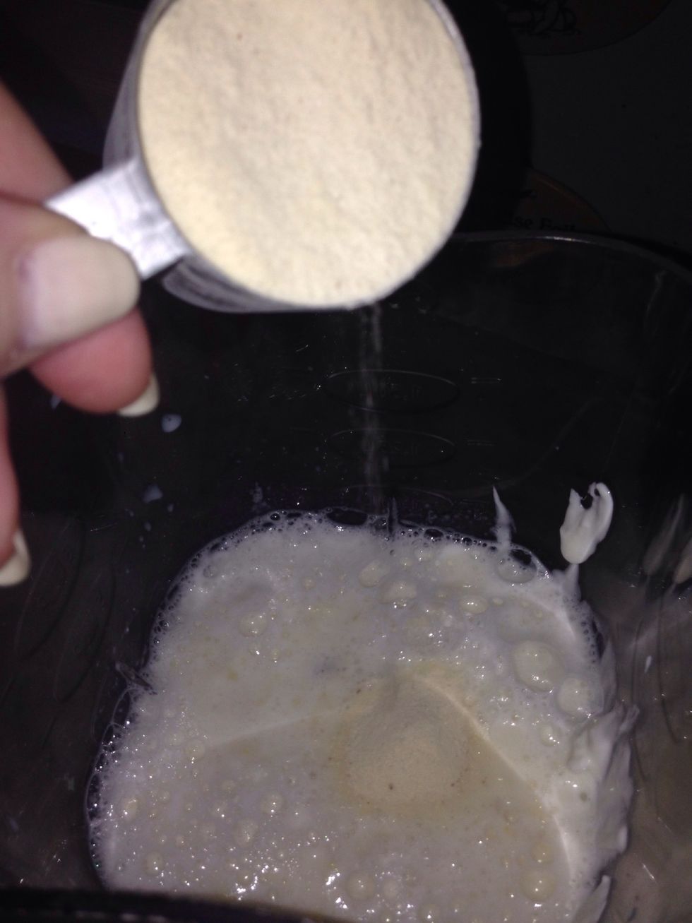 After that is mixed up I put in the protein powder.  I like designer whey because it doesn't taste like cardboard ran over by skunk.  Vanilla is my flavor of choice.  1 scoop!
