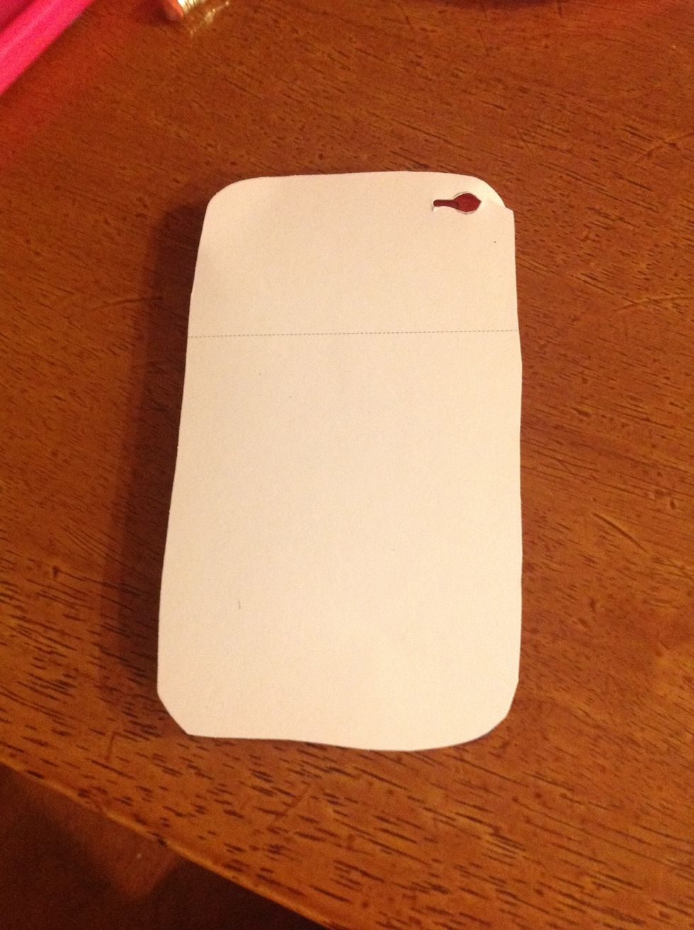 After that, lay the paper on top of the case and if it doesn't fit, cut down the case little by little