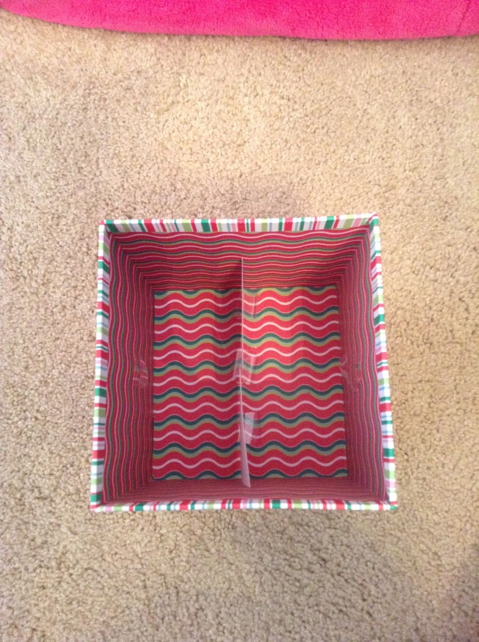 After that, place the index card in the box with the slit facing upwards. If it isn't stable or falls, place tape on the sides of the box and secure the index card to them.