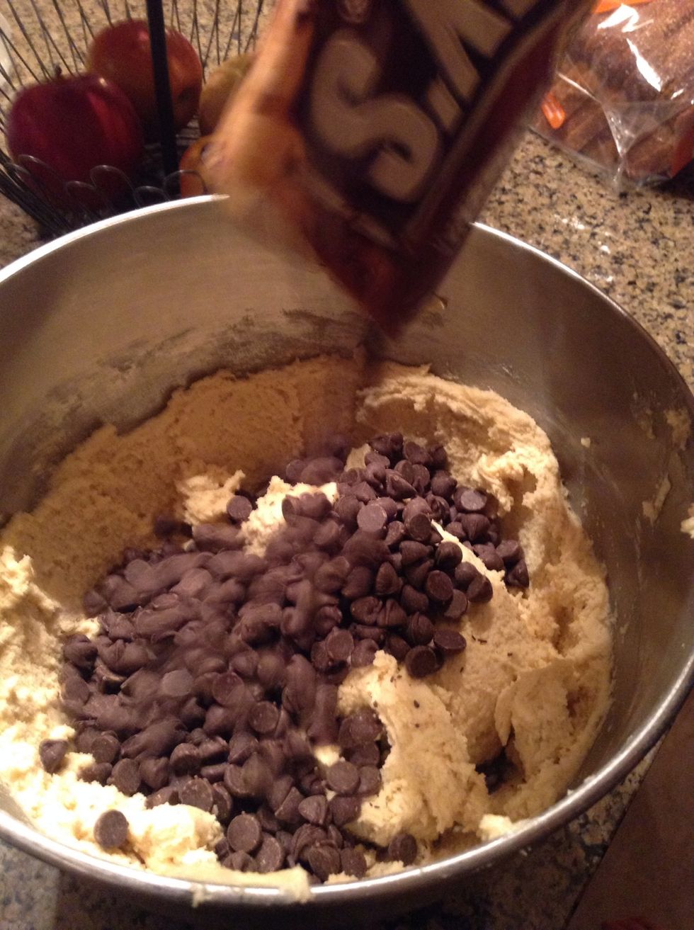 After that pour in 2 cups of chocolate chips and hand stir to get the chocolate chips everywhere