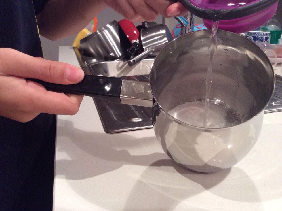 After that put in one cup of room-temperature water and give it a bit of a stir. Put it on a medium flame for about five minutes stirring constantly.