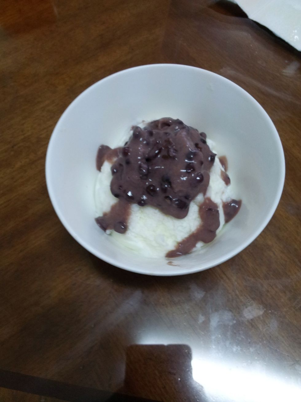 After that, take your smashed frozen milk from the refrigerator, take the Popsicle that you just smashed and put it on top of the frozen milk above.