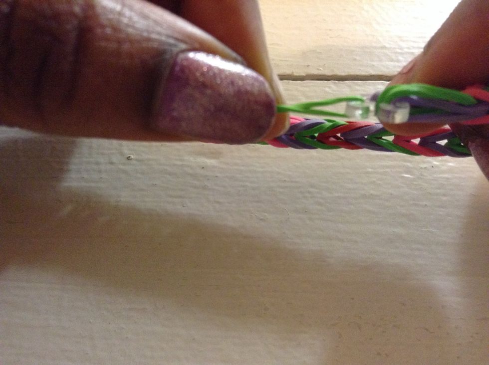 After, that you can take the rubber bands off the pegs and then you can add your clip.