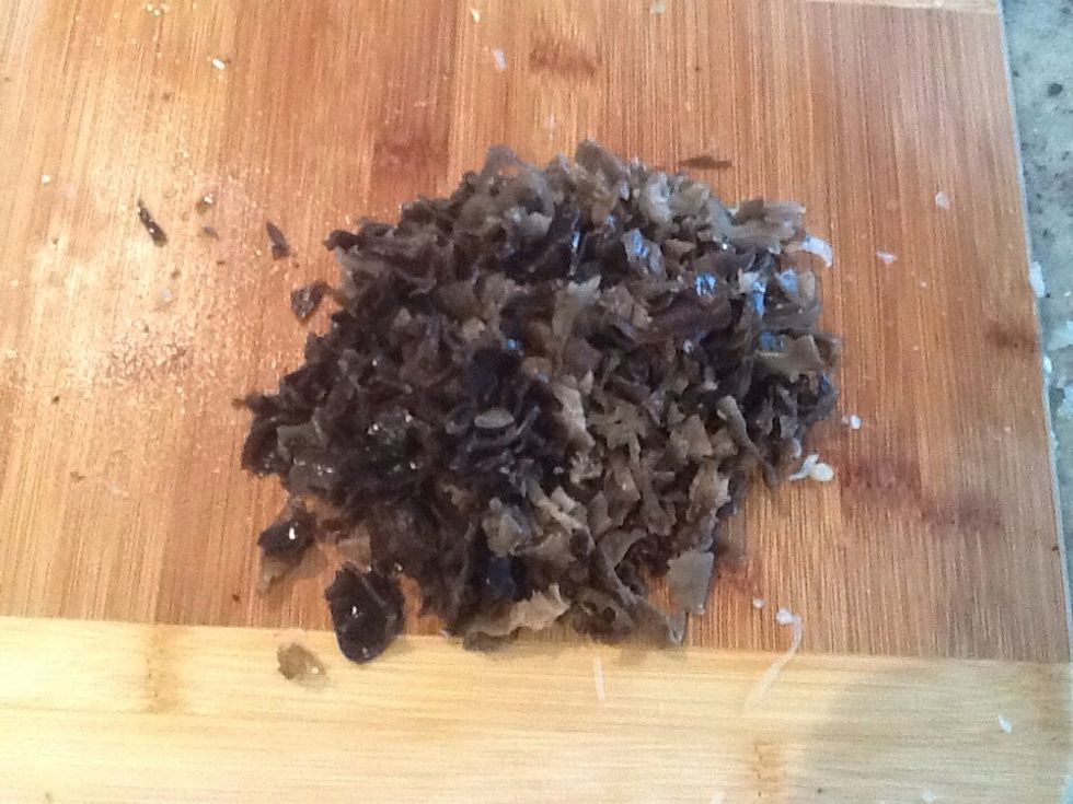 After that you put the mushroom in hot water for about 15 mins to make it soft and cut it up like this
