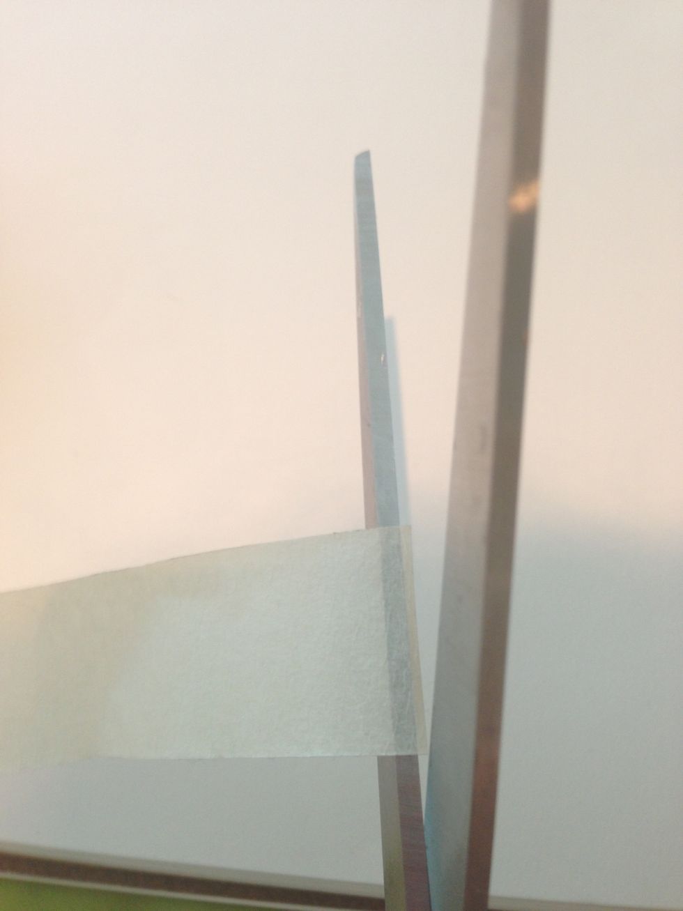 After that you will place your tape onto the blade of your scissor. BE CAREFUL