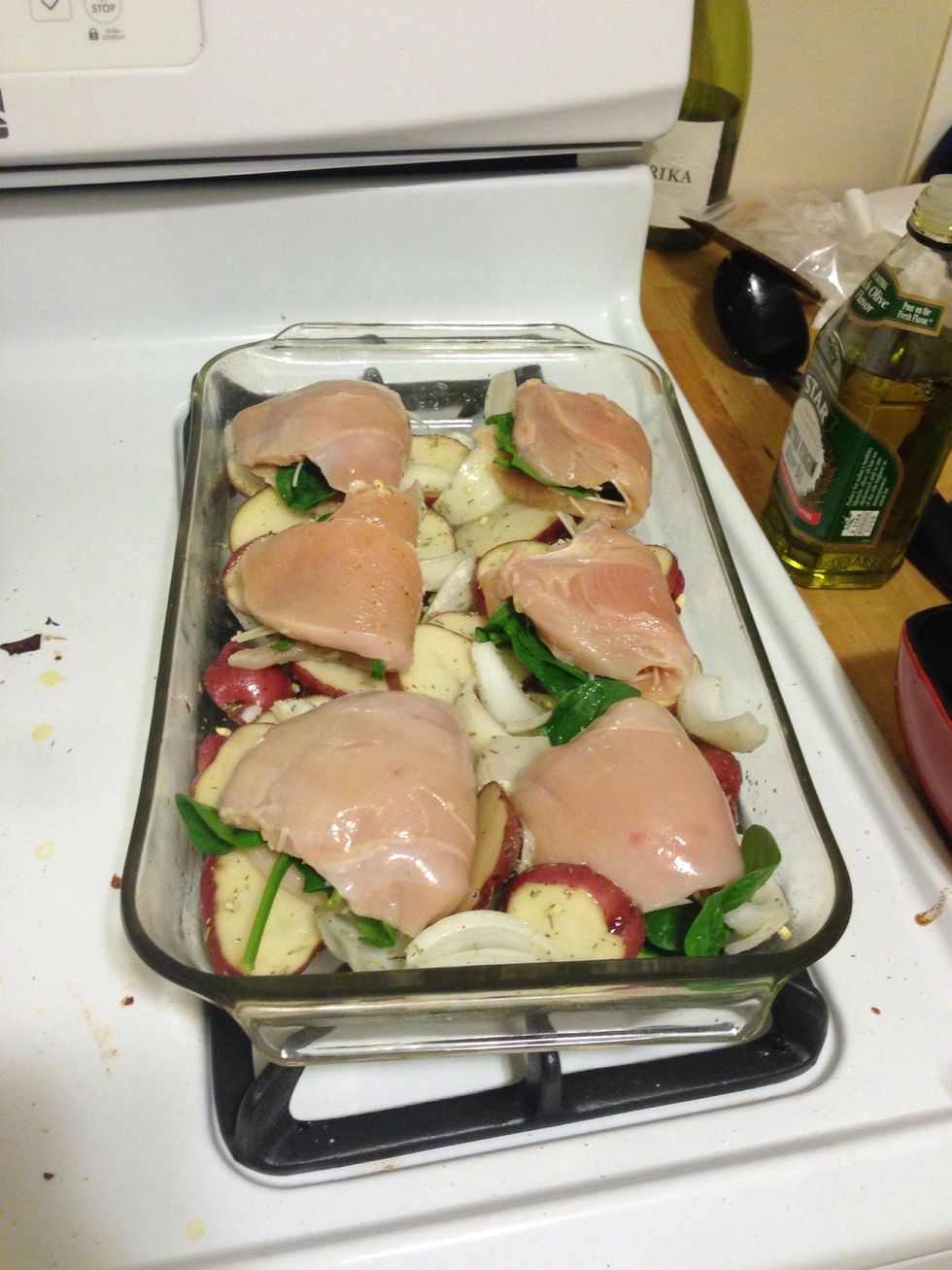 After the 10 minutes for the potatoes are finished, put the chicken breast on top of the potatoes.