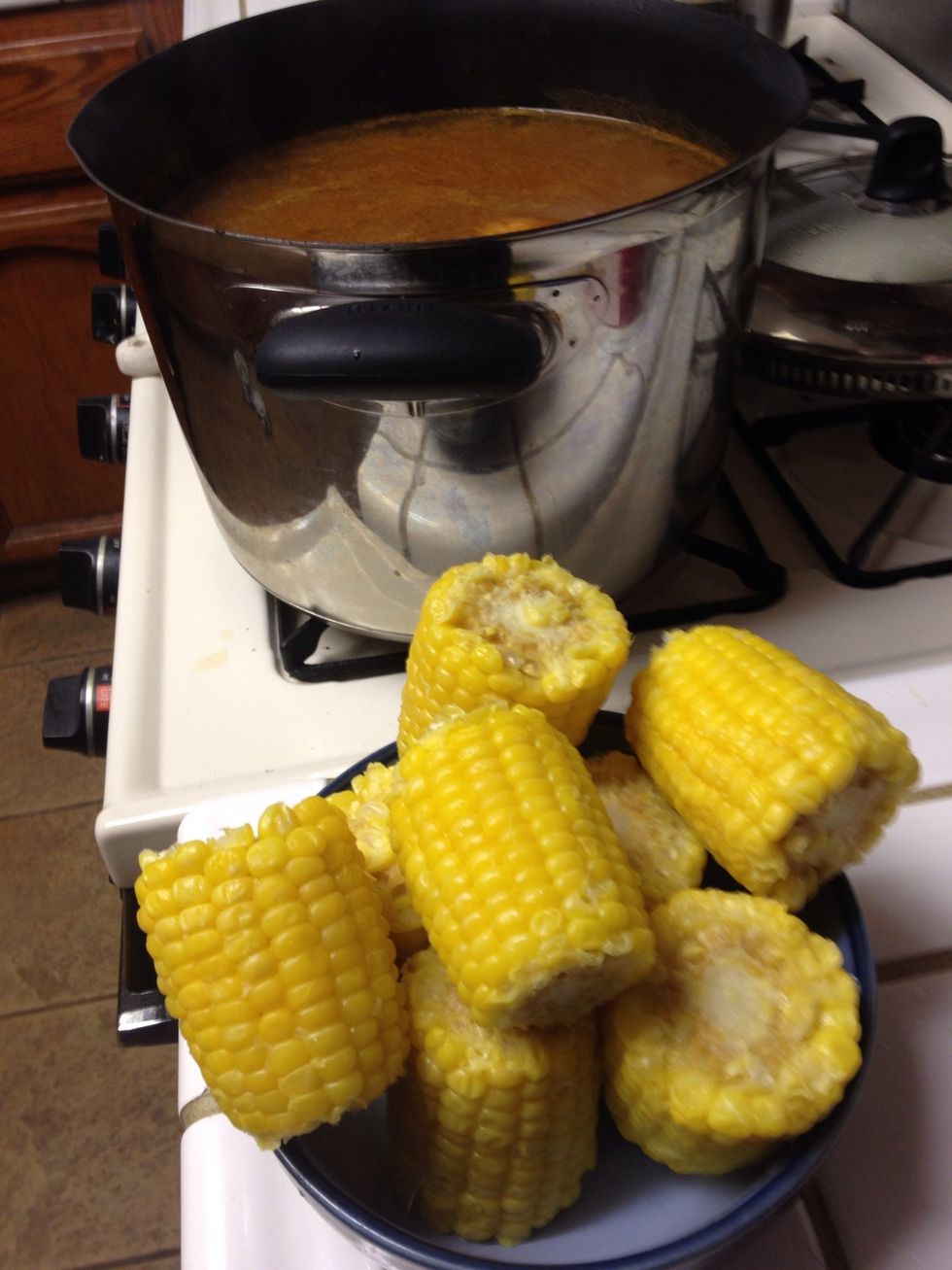 After the 15 mins are up add the corn and boil for 10 mins more.