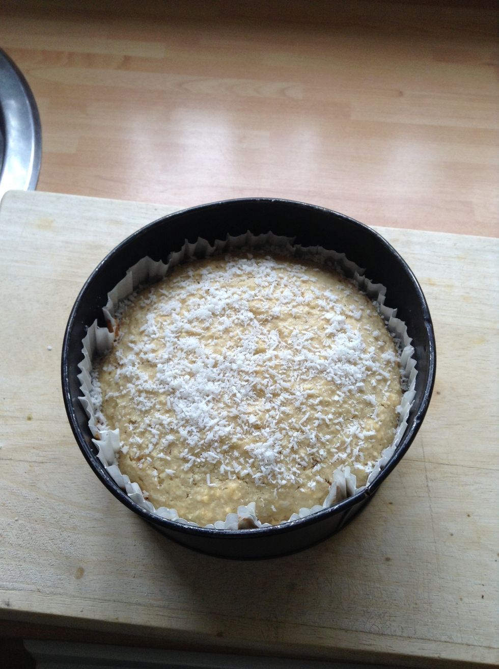 After the 30 mins remove the cake from the oven and sprinkle with some remaining coconut