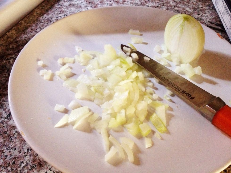 After the bacon has been chopped, it's time to dice the onion. Peel the onion and dice it to 1/2-inch (or whichever size you prefer).