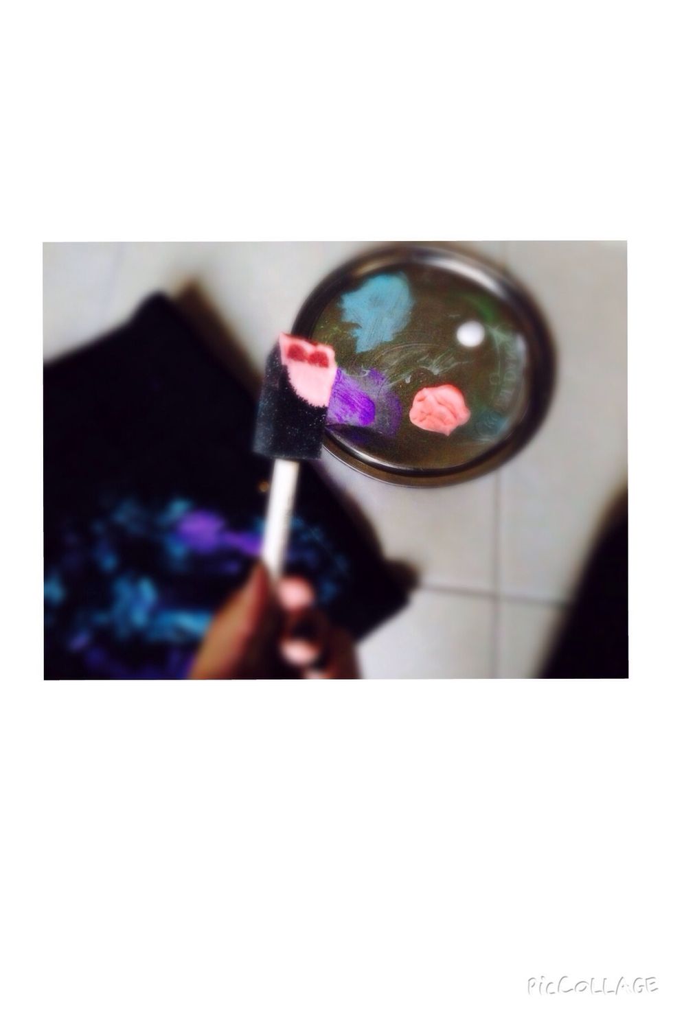 After the blue fabric paint, load another sponge with the pink fabric paint.