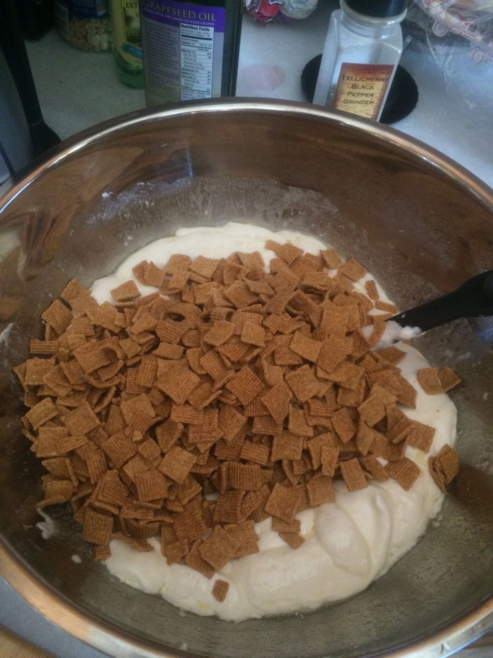 after the butter and marshmallows have been softened put in a bigger bowl and add in about 3-4 cups of golden grahams